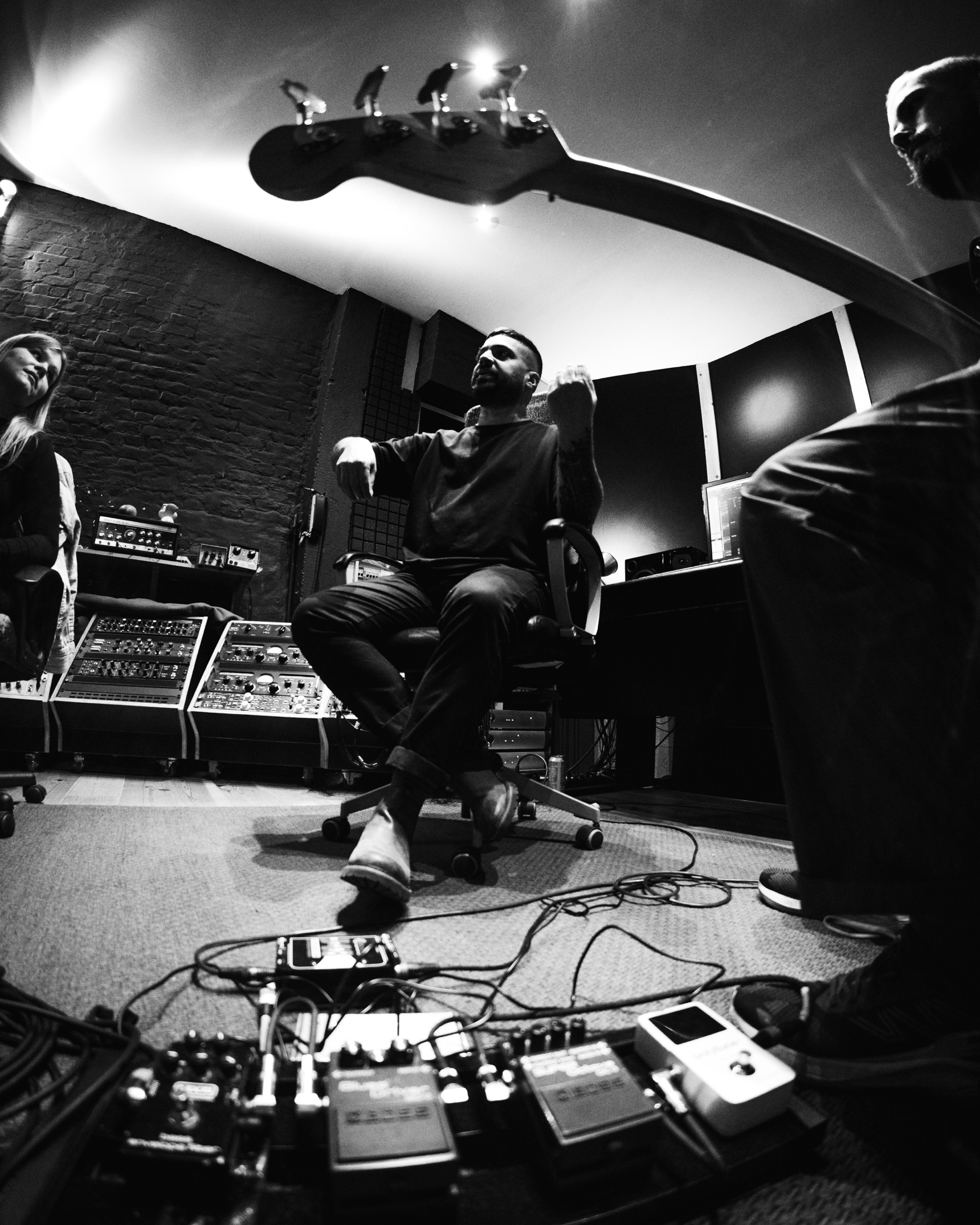 Imran Siddiqi shaping an arrangement with artists in the studio